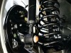 What is a coilover strut?